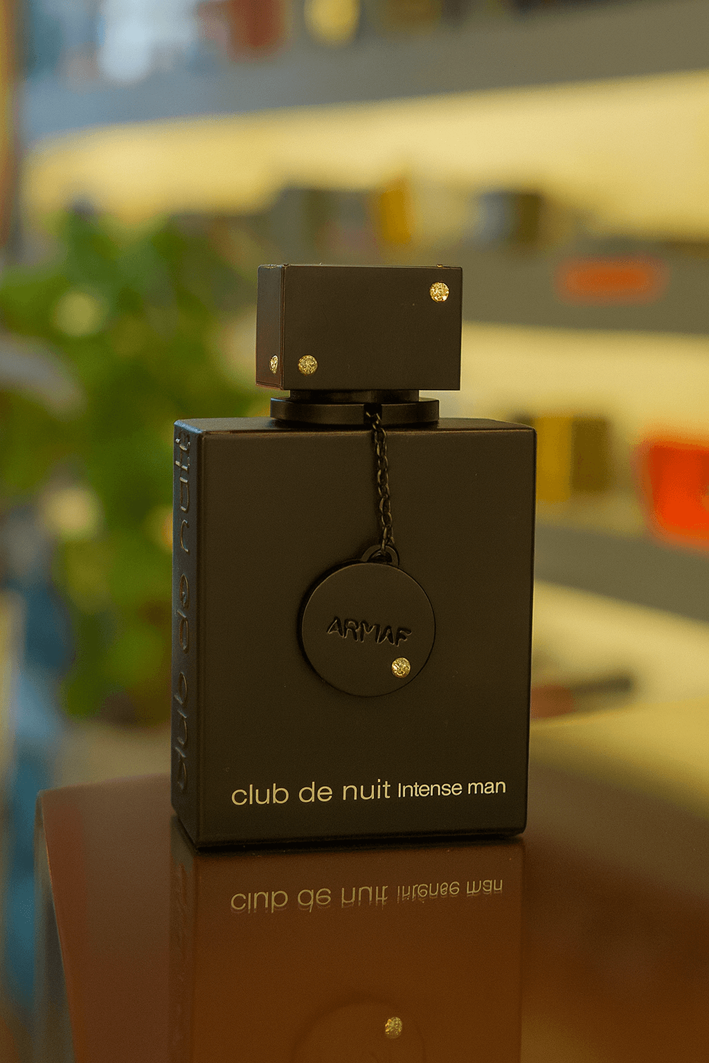 A bottle of Armaf Club de Nuit perfume for men.